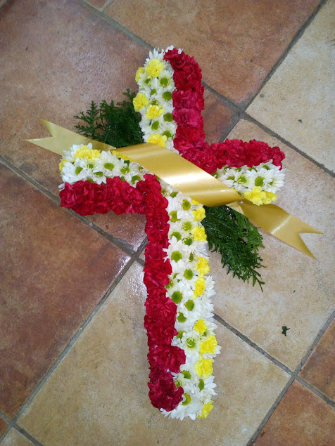 red and gold funeral cross tribute