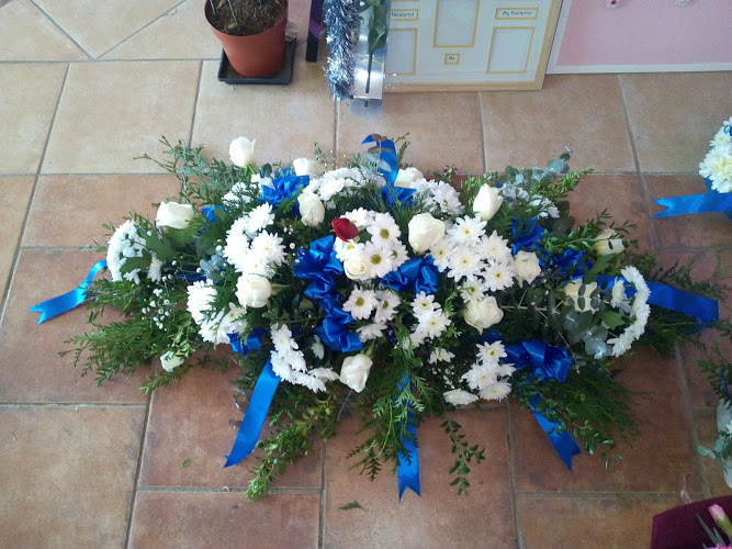 royal blue and white funeral spray